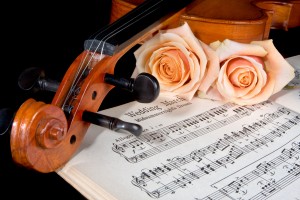 Sheet music of the Wedding March; with roses and violin